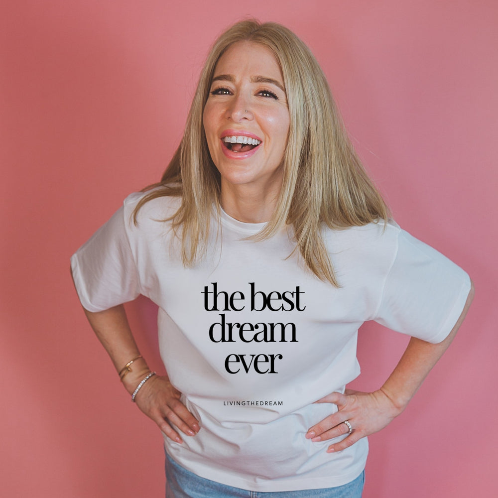 Smiling woman wearing personalized statement shirts by dreamwithreem with the text the best dream ever