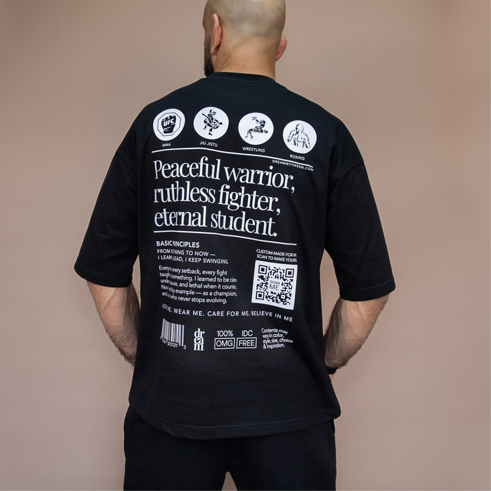 Custom statement oversized tee with unique graphic design and inspirational text on the back