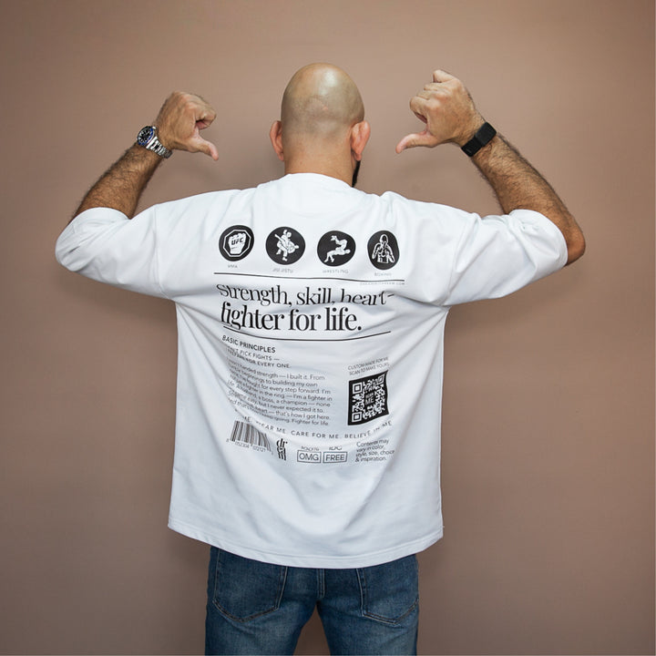 Custom white statement oversized tee featuring motivational graphics and back design for inspiration