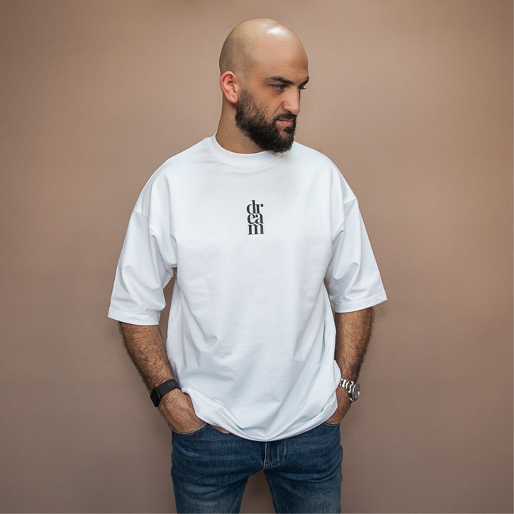 Men's white statement oversized tee from dreamwithreem with a simple logo design