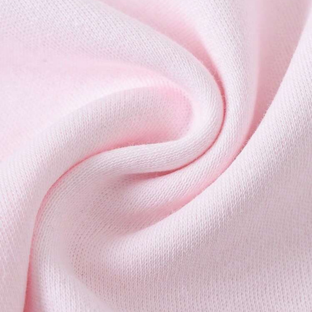 Soft pink cotton personalized infant bodysuit fabric close up showing knit texture and stretch