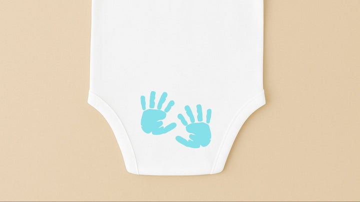 White short sleeve personalized infant bodysuit with blue handprint prints on back for baby