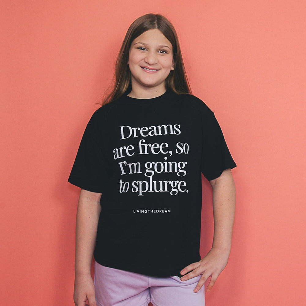 Girl wearing dreamwithreem custom black t-shirt with white text unique self-expression tee