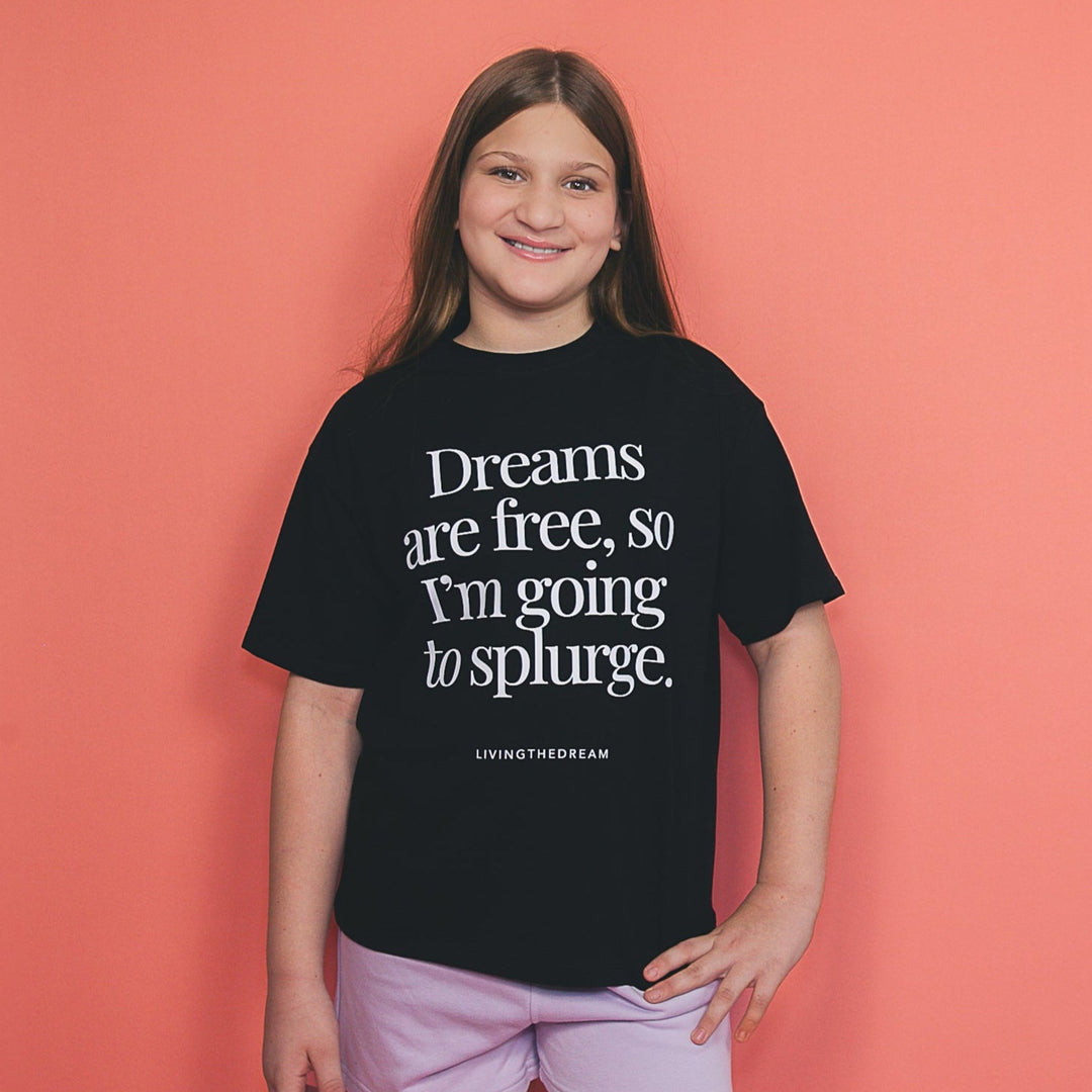 Girl wearing dreamwithreem custom black t-shirt with white text unique self-expression tee