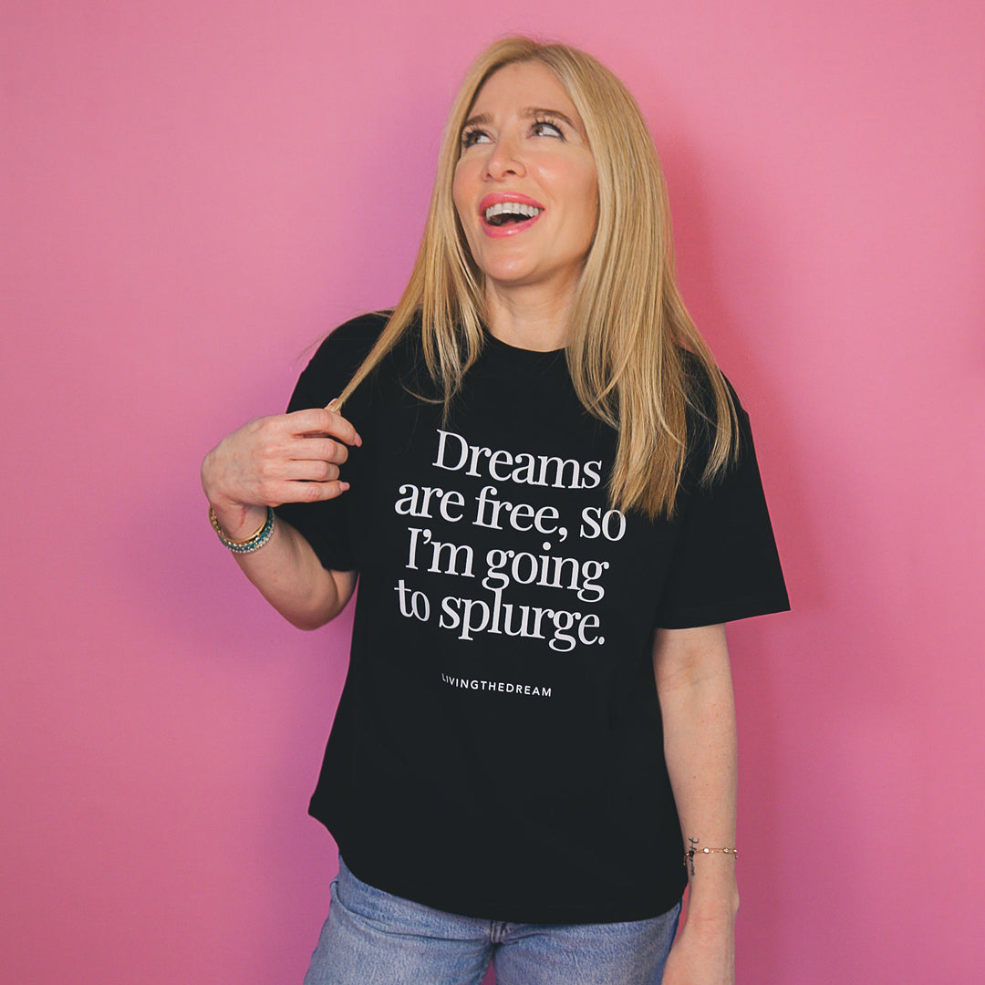 Woman wearing black custom T-shirt with inspirational quote showing unique self-expression tee