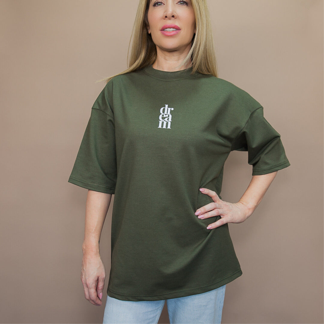Woman wearing a green custom t-shirt featuring unique streetwear tee design for casual styles