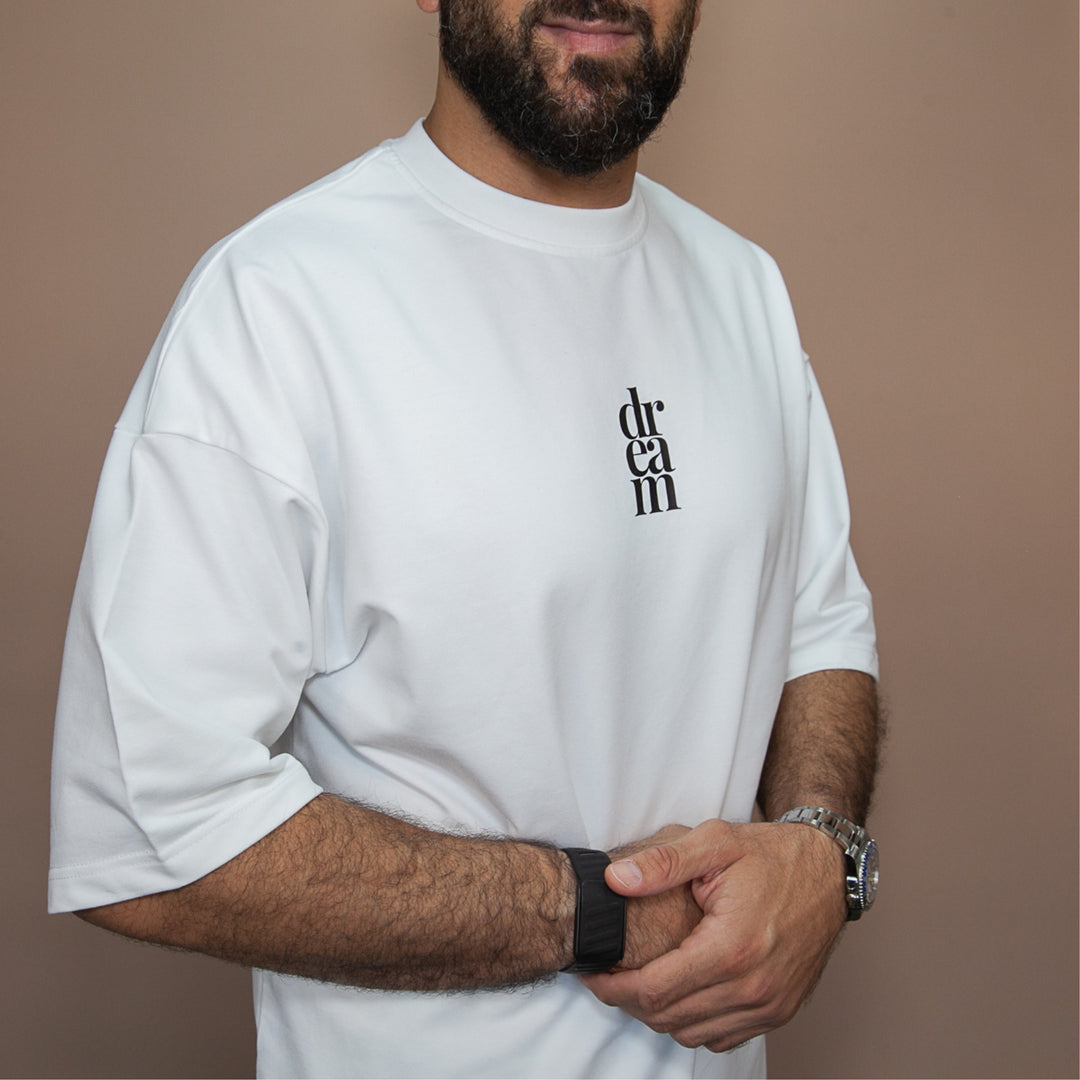 White custom t-shirt from dreamwithreem featuring a stylish logo, perfect unique streetwear tee
