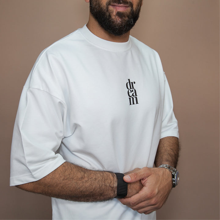 White custom t-shirt from dreamwithreem featuring a stylish logo, perfect unique streetwear tee