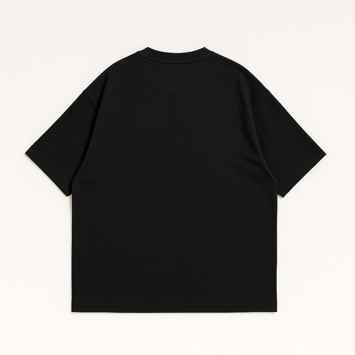 Black custom oversized tee laid flat showing the back with short sleeves and relaxed fit by dreamwithreem